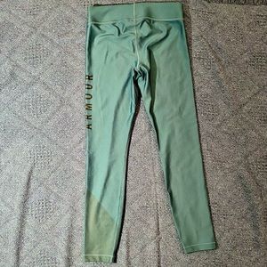 Under Armour HeatGear compression athletic tights. Light teal color. Size Large.